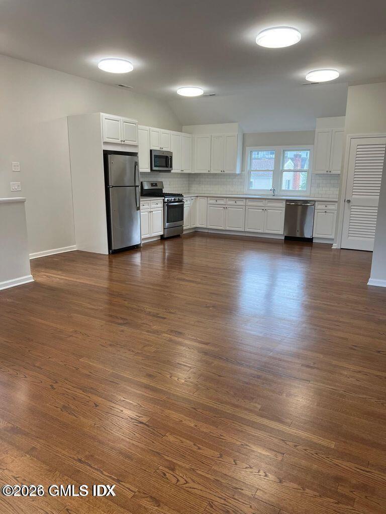 19 Bible Street, Unit 2 Cos Cob, CT 06807 - Photo 6 of 26 a view of a kitchen with a sink and a stove top oven