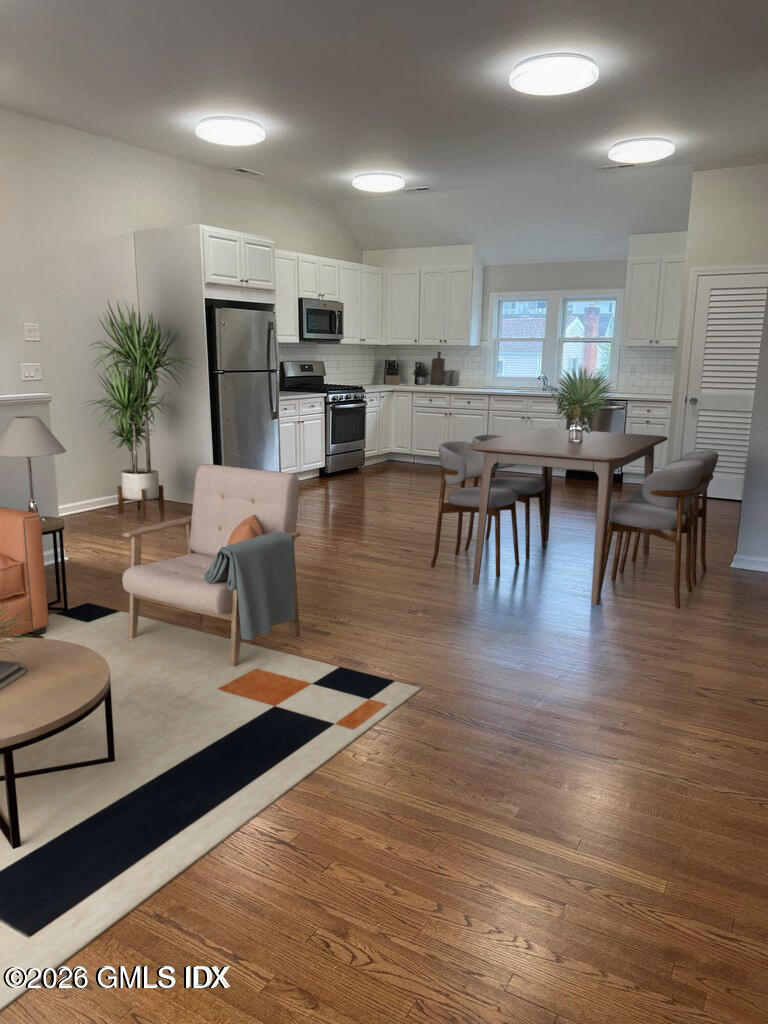 19 Bible Street, Unit 2 Cos Cob, CT 06807 - Photo 7 of 26 a living room with fireplace furniture and a wooden floor