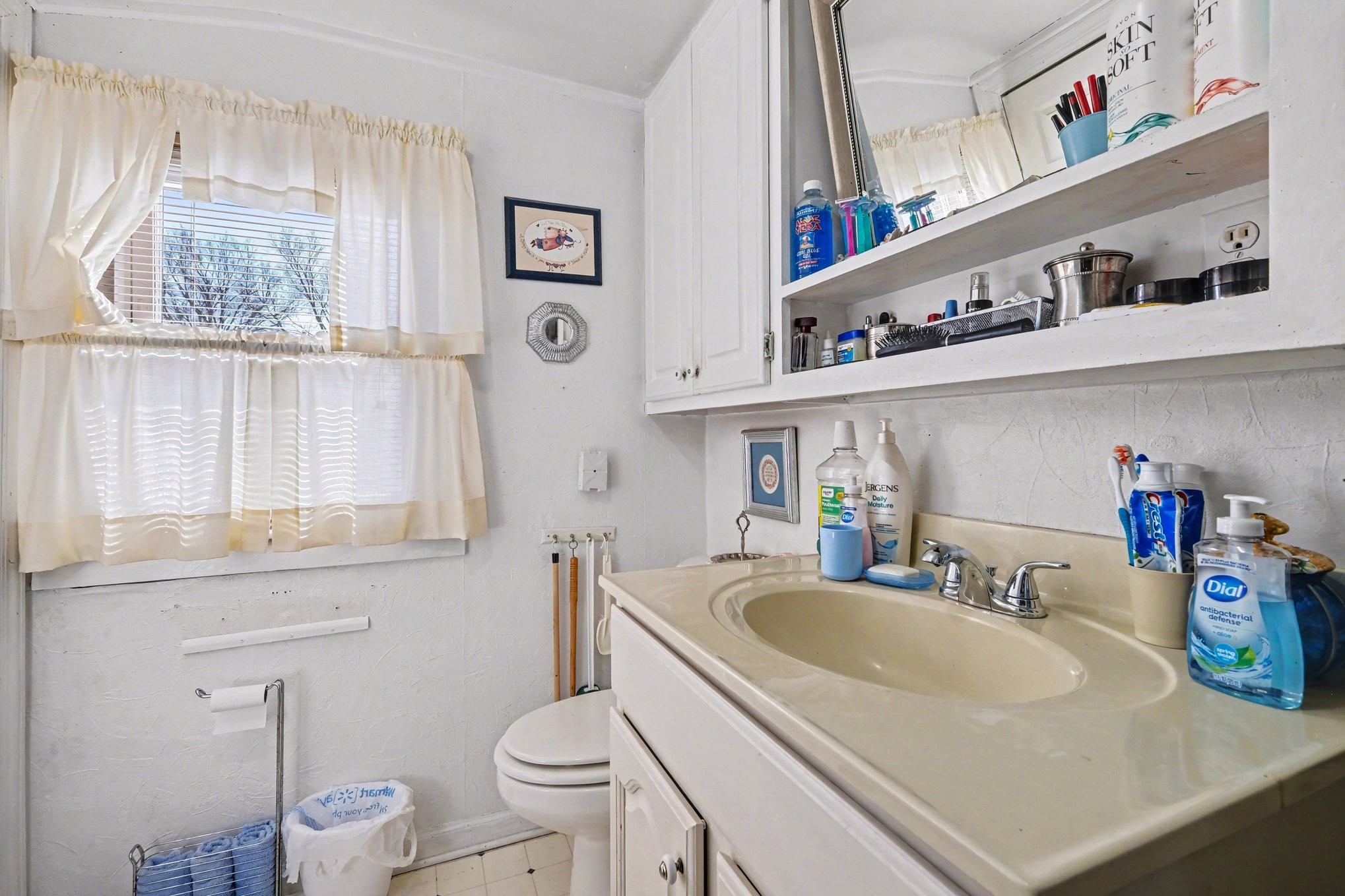 1801 Scribner Avenue Columbia, TN 38401 - Photo 15 of 30 a bathroom with a sink a toilet and a window