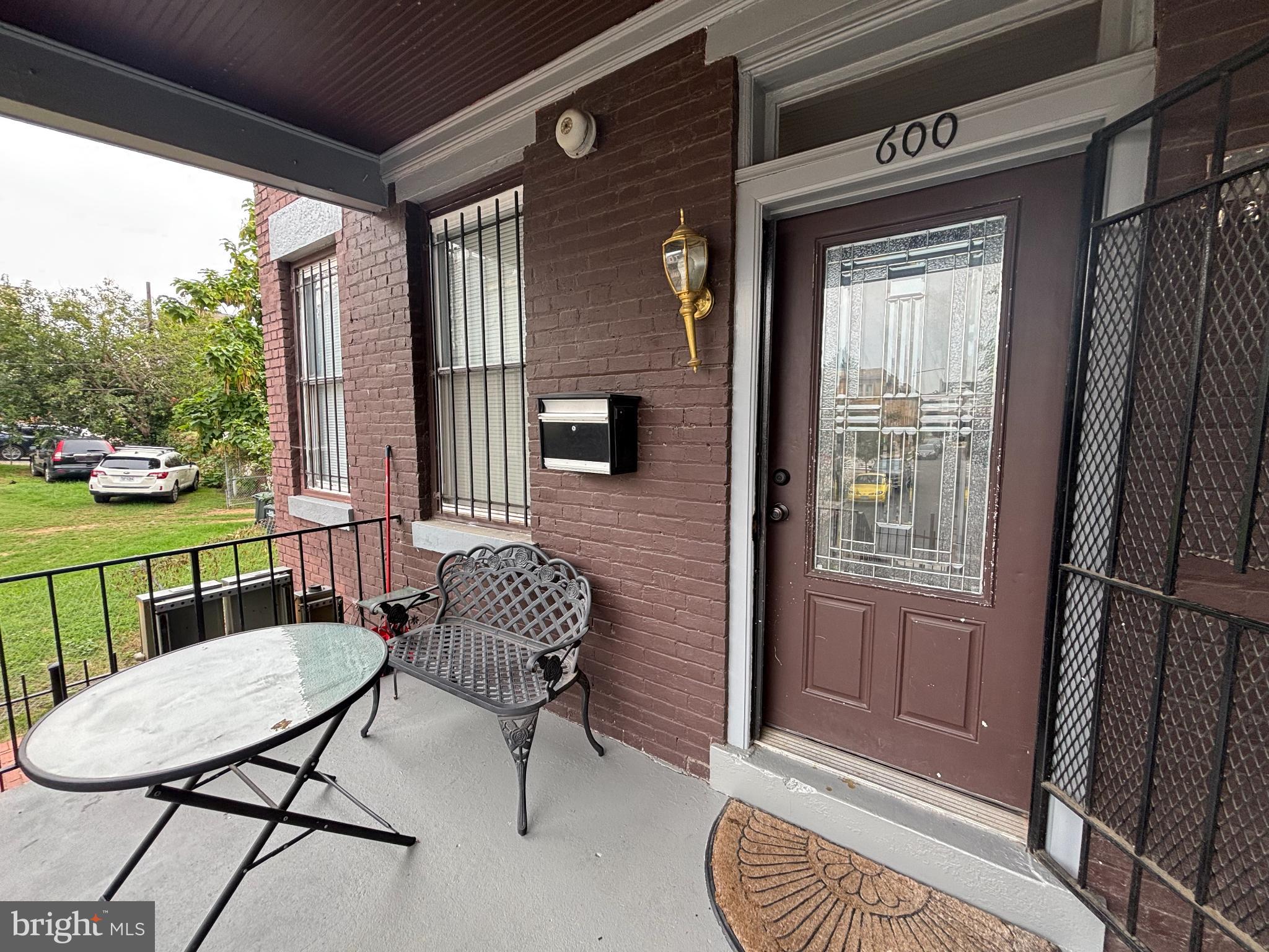 600 Keefer Place Northwest, Unit 1 Washington, DC 20010 - Photo 14 of 15 a view of a porch with furniture and a yard