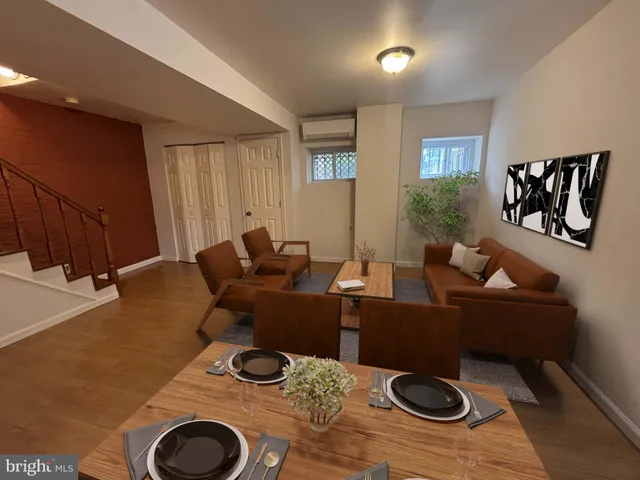 a living room with furniture and a rug