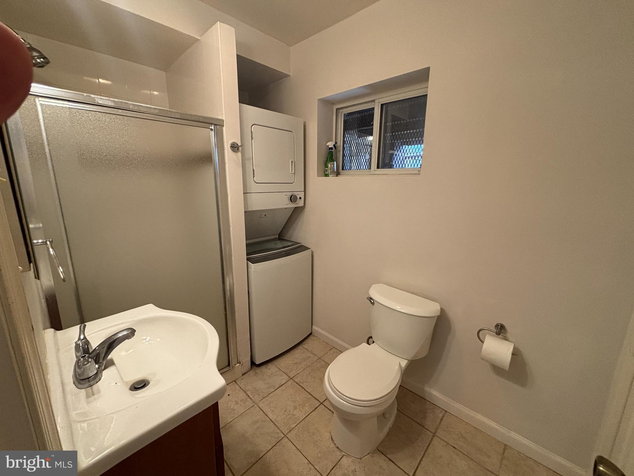 600 Keefer Place Northwest, Unit 1 Washington, DC 20010 - Photo 7 of 15 a white toilet sitting next to a bathroom sink