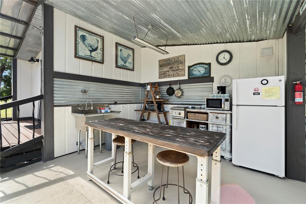 7650 Northeast 40th Street High Springs, FL 32643 - Photo 24 of 75 a kitchen with stainless steel appliances granite countertop a stove and a refrigerator