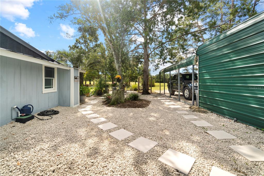 7650 Northeast 40th Street High Springs, FL 32643 - Photo 29 of 75 a view of a backyard with sitting area