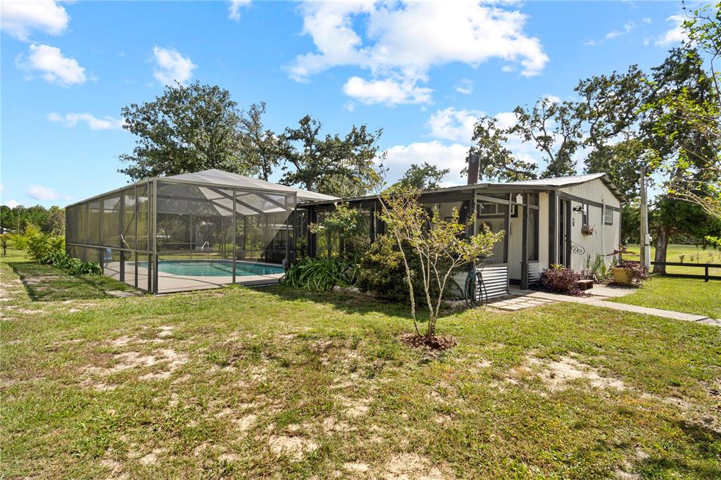 7650 Northeast 40th Street High Springs, FL 32643 - Photo 36 of 75 a view of a house with backyard and tree