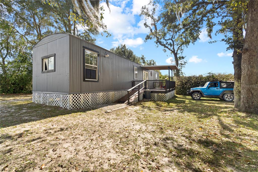 7650 Northeast 40th Street High Springs, FL 32643 - Photo 42 of 75 a front view of a house with a yard