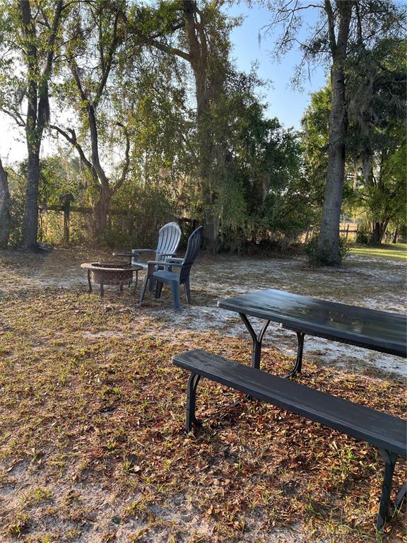 7650 Northeast 40th Street High Springs, FL 32643 - Photo 44 of 75 a view of a backyard with sitting area