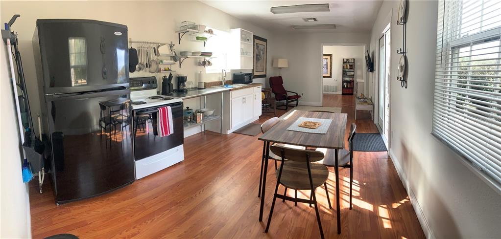 7650 Northeast 40th Street High Springs, FL 32643 - Photo 48 of 75 a view of a dining room with furniture and wooden floor