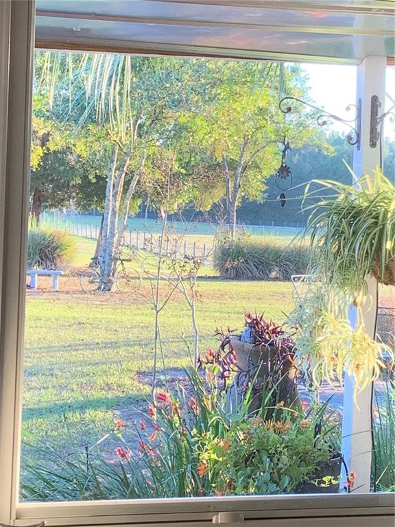 7650 Northeast 40th Street High Springs, FL 32643 - Photo 62 of 75 a view of a garden and a lake