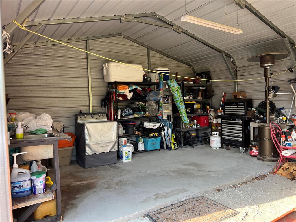 7650 Northeast 40th Street High Springs, FL 32643 - Photo 69 of 75 a view of a garage with storage