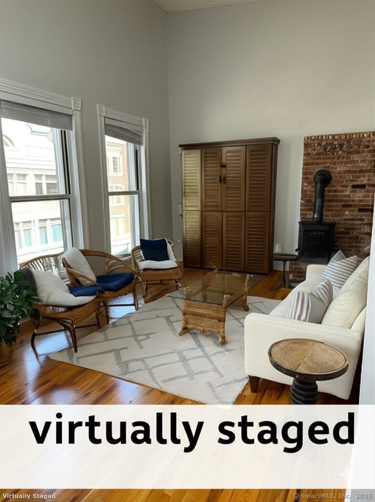 118 Washington Street, Unit 302 Norwalk, CT 06854 - Photo 1 of 1 a living room with furniture flowerpot and window