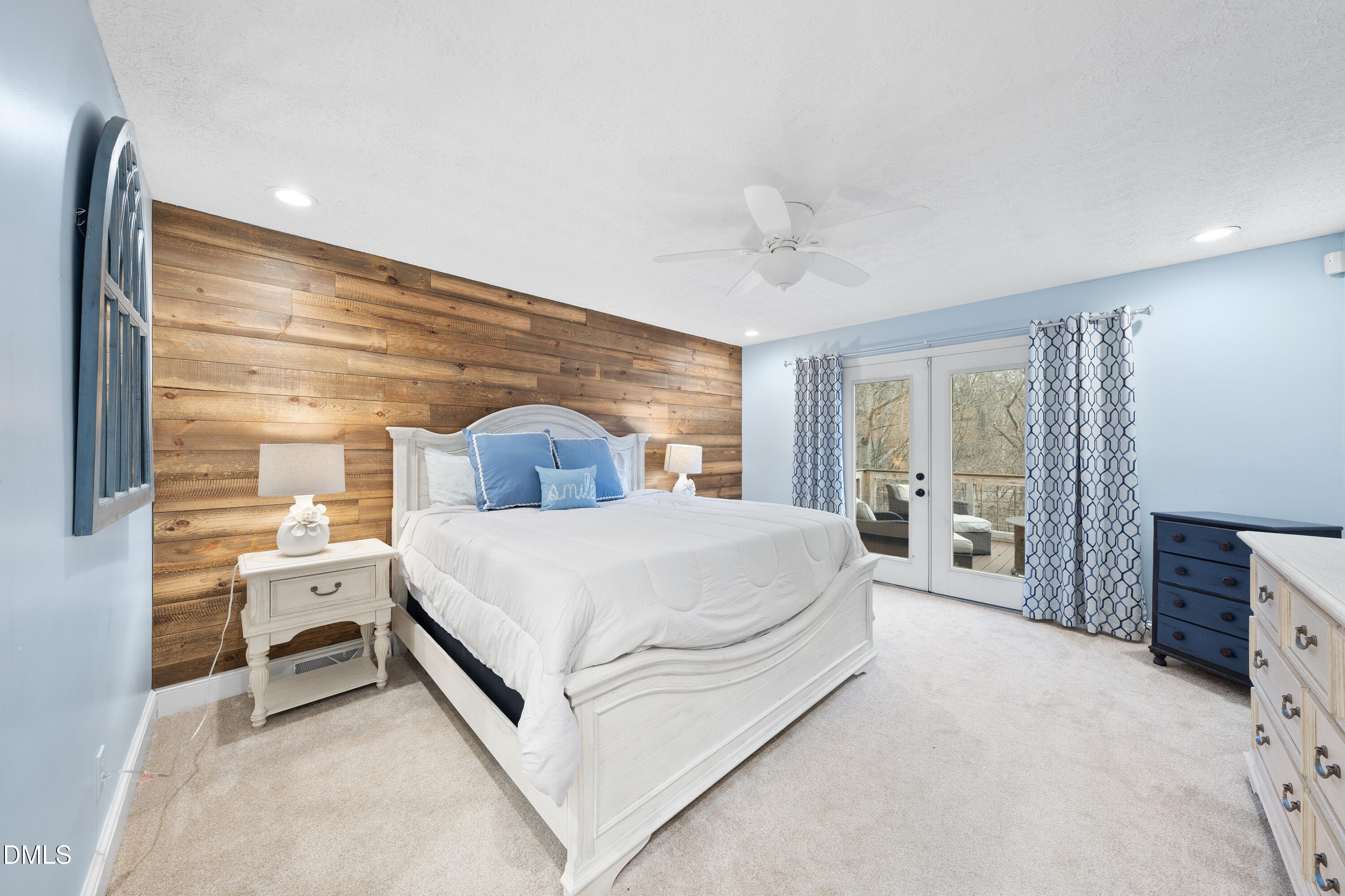 1121 Osmond Road Leasburg, NC 27291 - Photo 16 of 39 a spacious bedroom with a bed and a large window