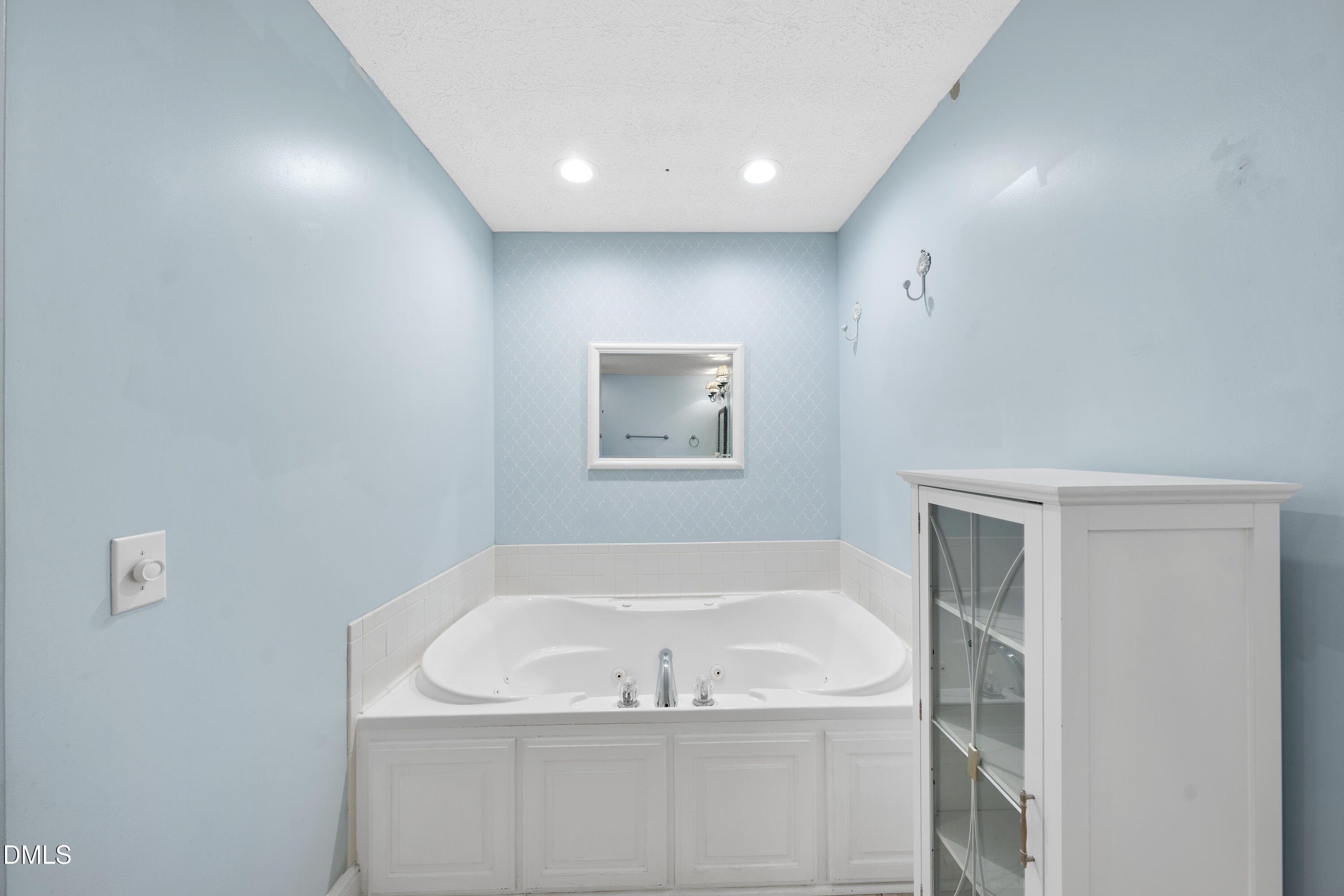 1121 Osmond Road Leasburg, NC 27291 - Photo 18 of 39 a white bath tub sitting in a bathroom