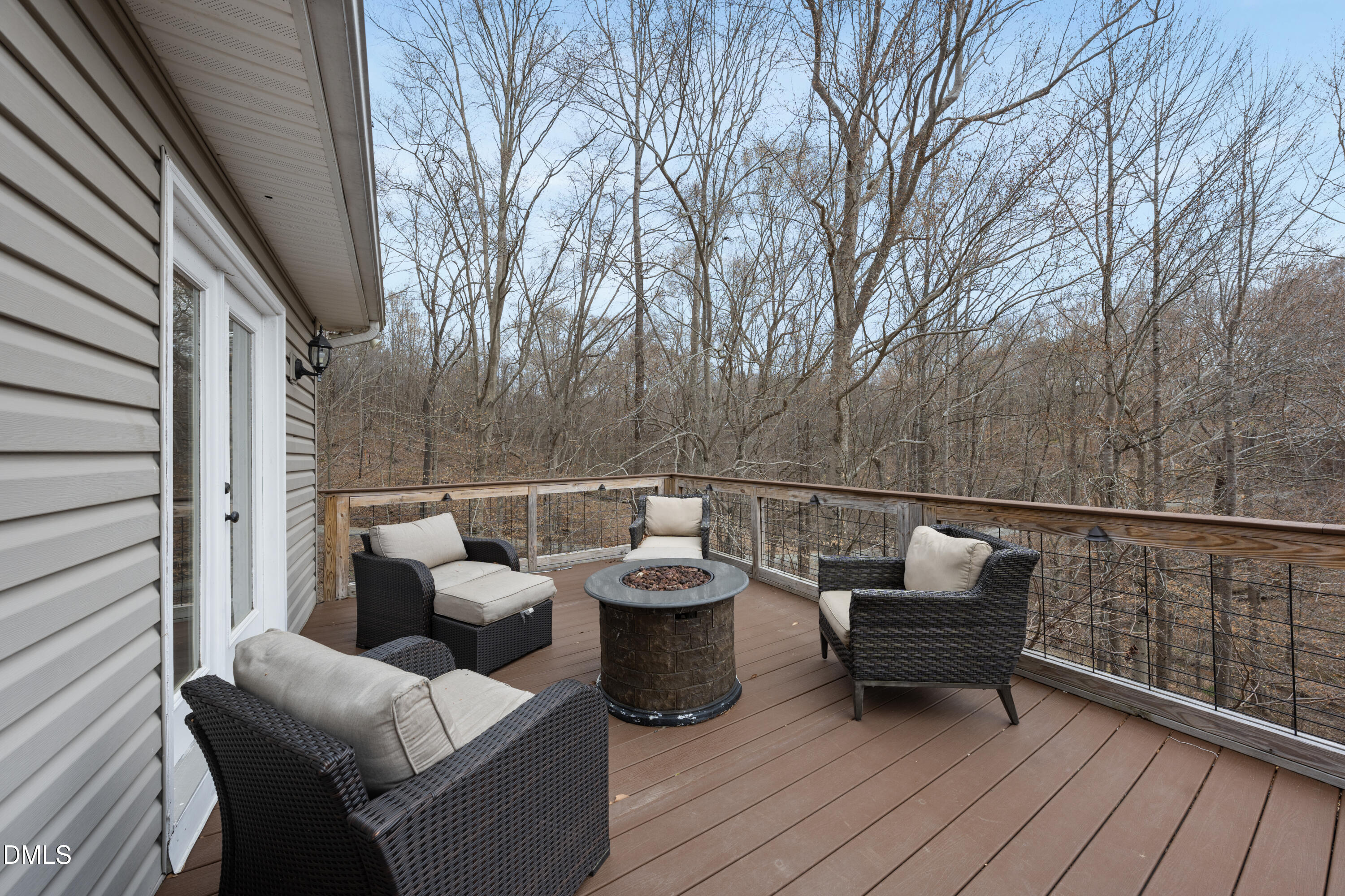 1121 Osmond Road Leasburg, NC 27291 - Photo 20 of 39 a balcony with wooden floor and outdoor seating