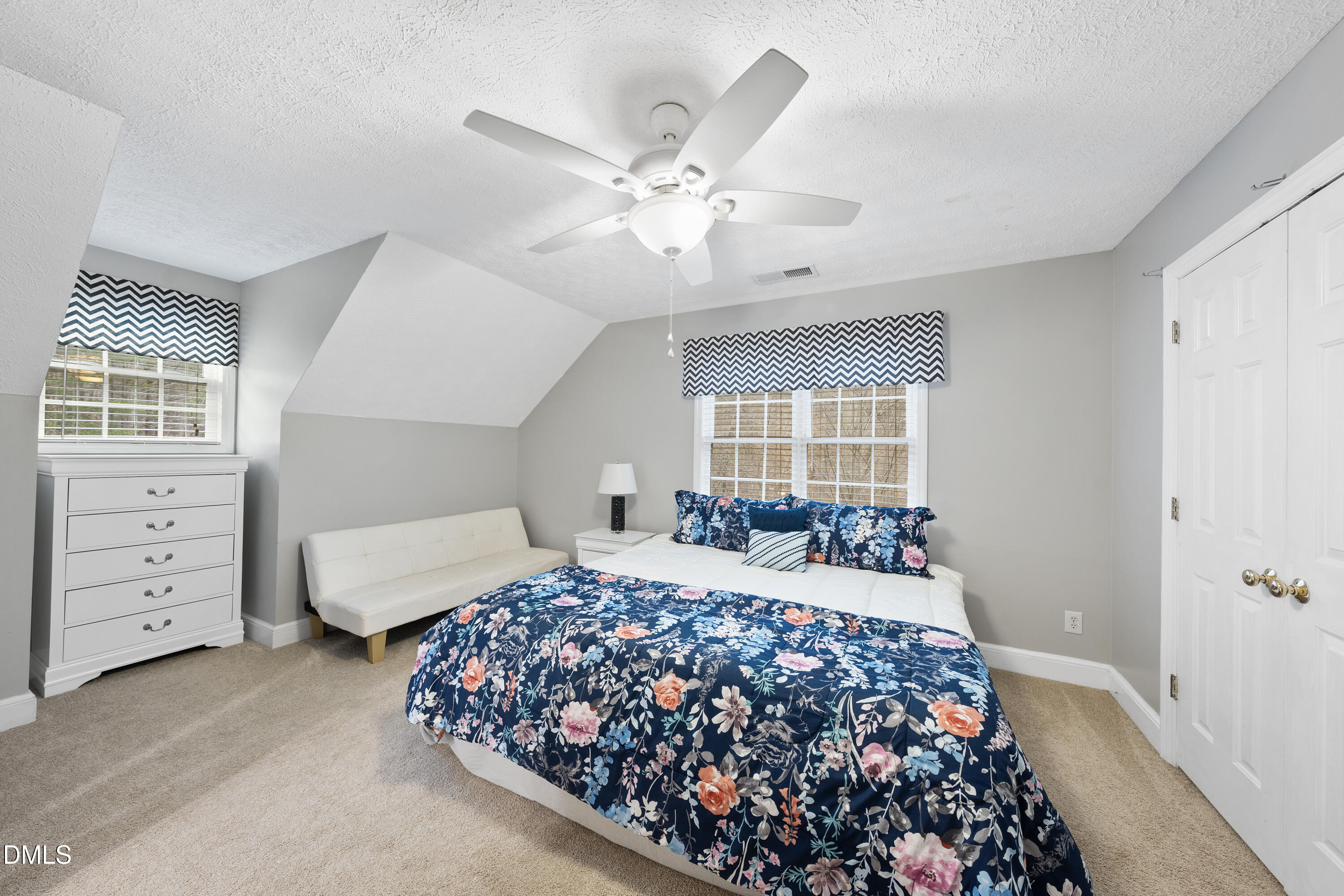 1121 Osmond Road Leasburg, NC 27291 - Photo 22 of 39 a bedroom with a large bed and a window