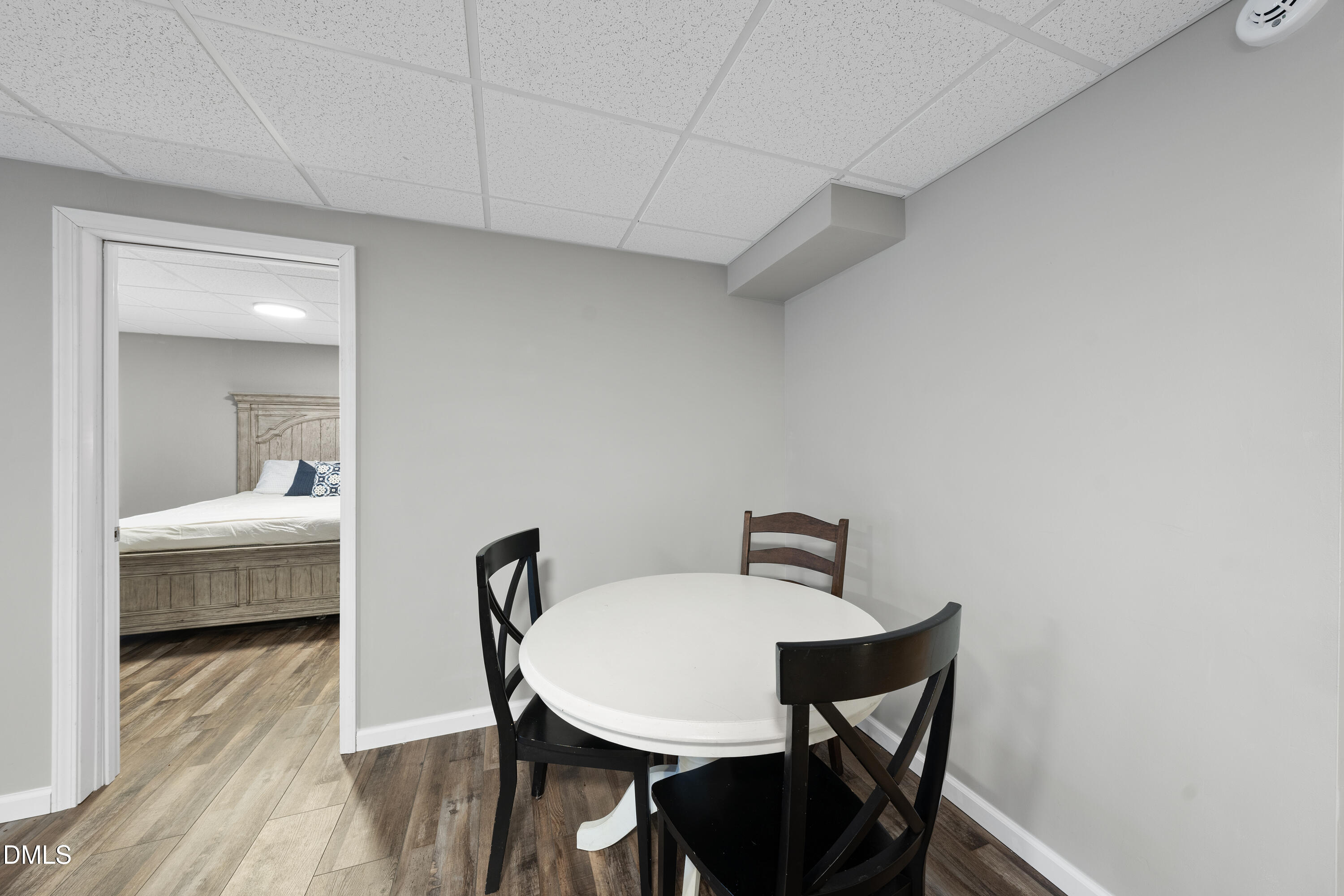 1121 Osmond Road Leasburg, NC 27291 - Photo 33 of 39 a bedroom with a bed and a mirror