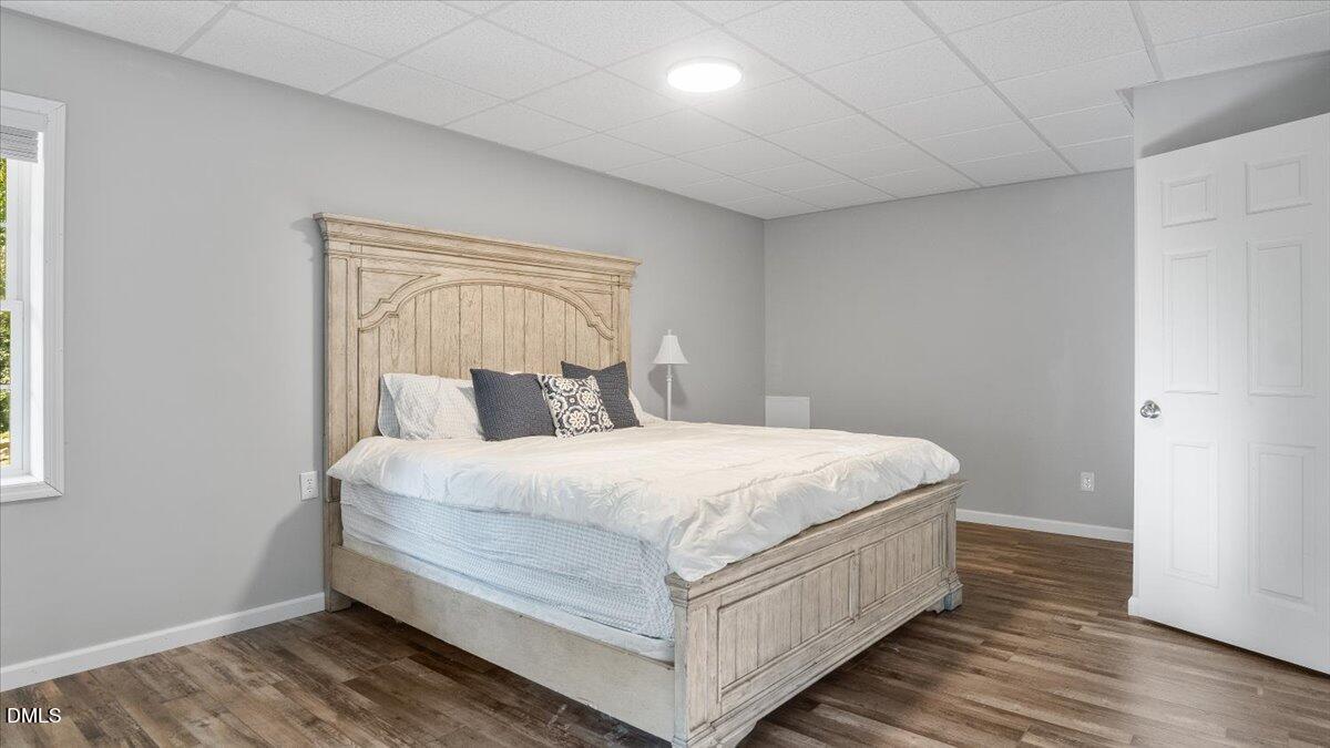 1121 Osmond Road Leasburg, NC 27291 - Photo 35 of 39 a large bed sitting in a bedroom next to a window