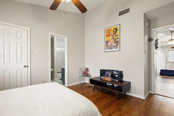 a bedroom with a bed and a couch