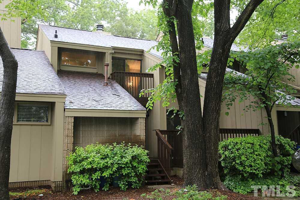 4100 Five Oaks Drive, Unit 49 Durham, NC 27707 - Photo 1 of 23 a front view of a house with garden