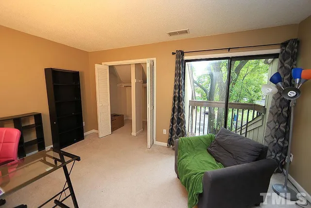 a view of livingroom with furniture and windows