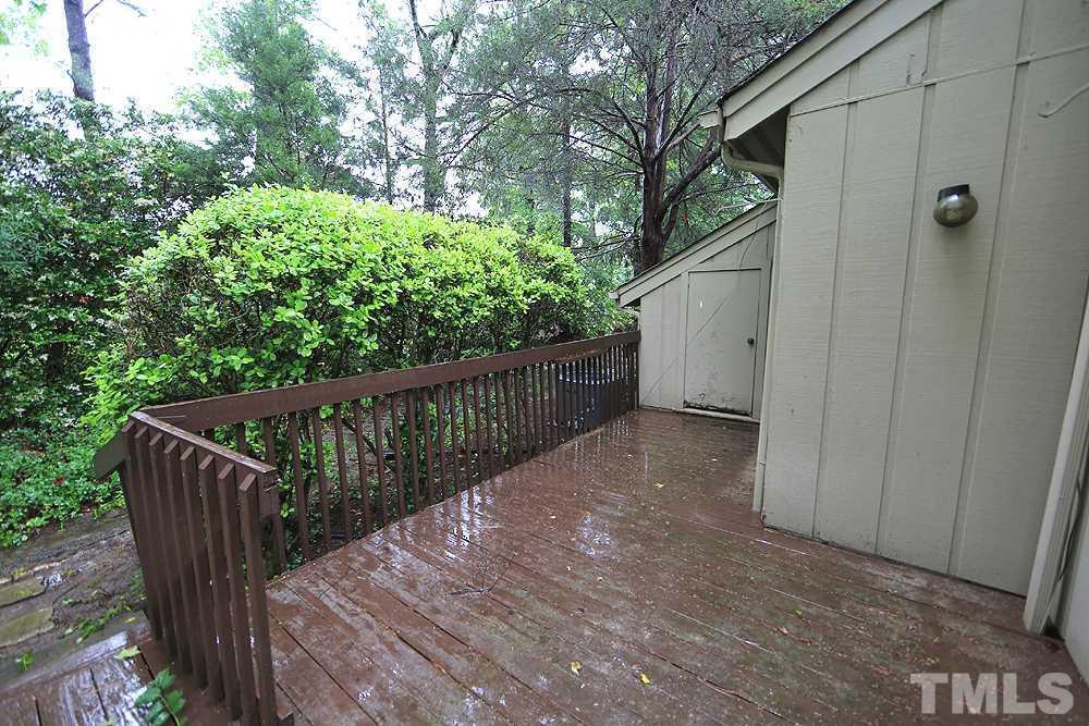 4100 Five Oaks Drive, Unit 49 Durham, NC 27707 - Photo 18 of 23 a view of a wooden fence and trees