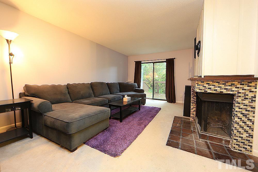 4100 Five Oaks Drive, Unit 49 Durham, NC 27707 - Photo 2 of 23 a living room with furniture and a fireplace
