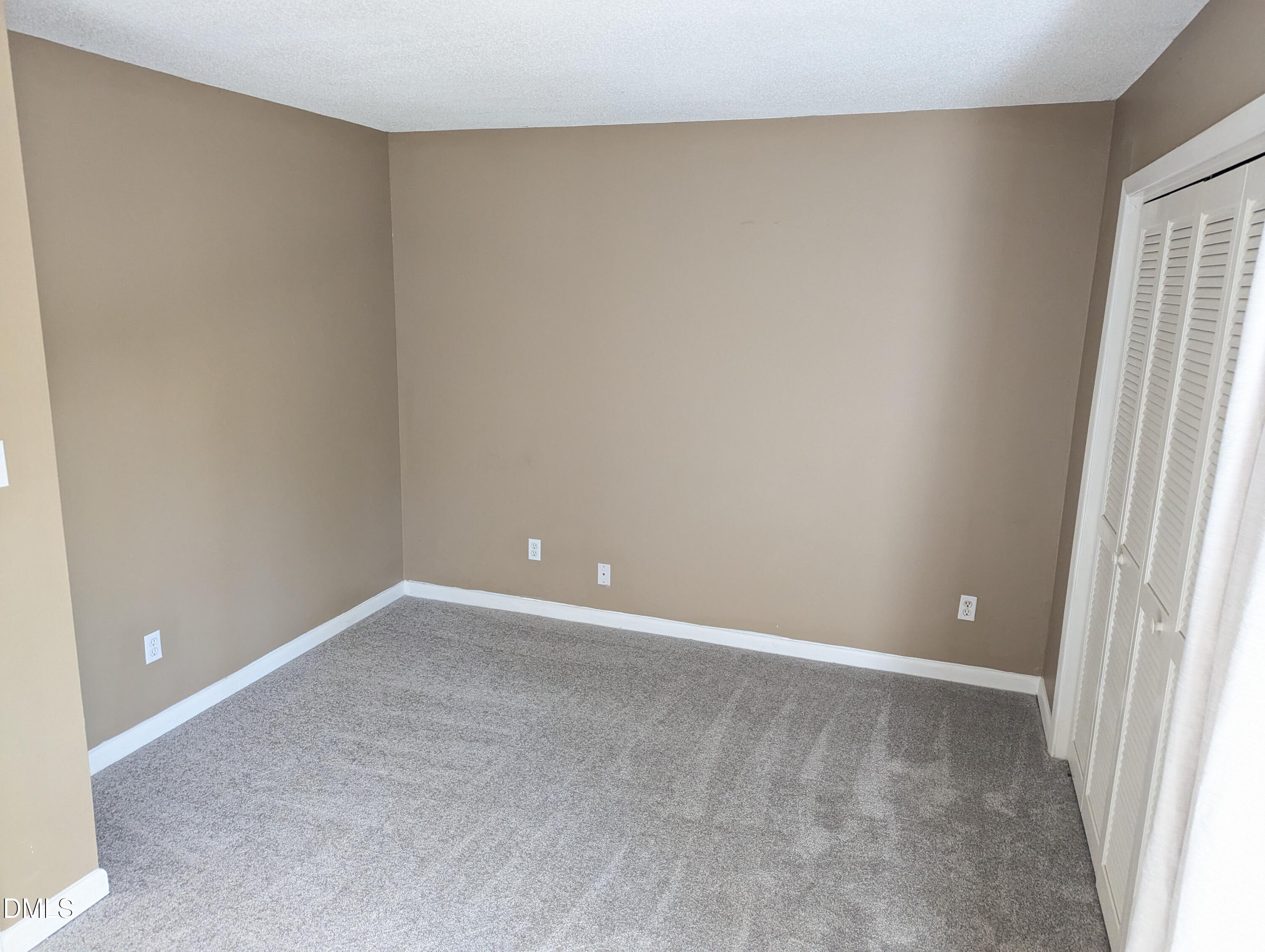 4100 Five Oaks Drive, Unit 49 Durham, NC 27707 - Photo 22 of 23 a view of an empty room with a window