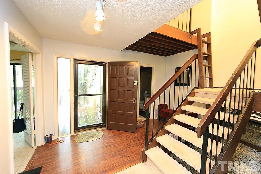 4100 Five Oaks Drive, Unit 49 Durham, NC 27707 - Photo 5 of 23 a view of entryway with wooden floor and stairs