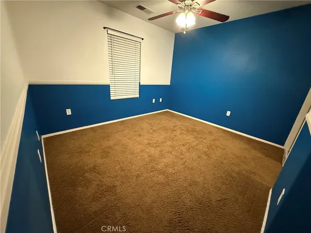 a bed room with a bed and a chandelier