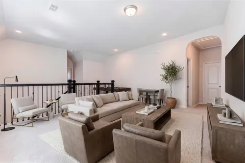 a bedroom with a large bed and a couch