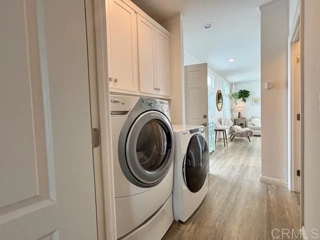 a view of a hallway with washer and dryer