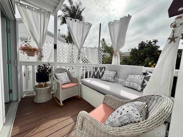699 North Vulcan Avenue, Unit 80 Encinitas, CA 92024 - Photo 6 of 27 a living room with furniture and a large window