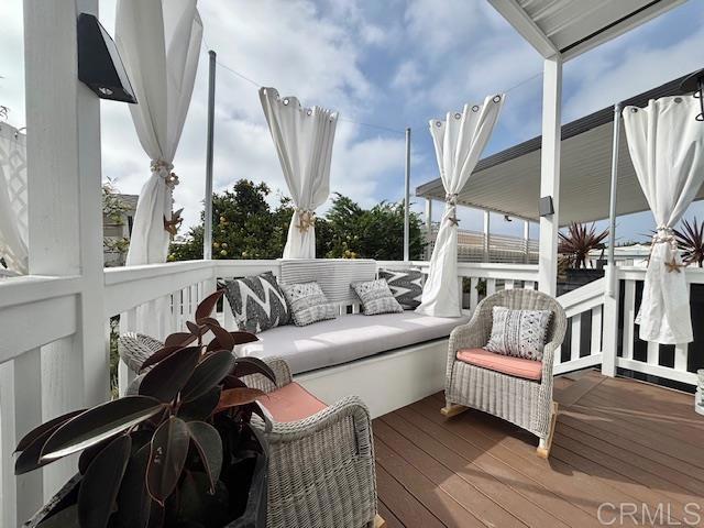 699 North Vulcan Avenue, Unit 80 Encinitas, CA 92024 - Photo 7 of 27 a living room with furniture and a large window