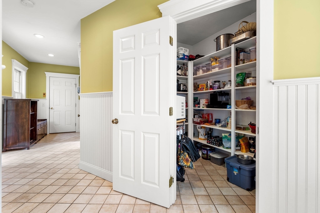 338 Pond Street Dunstable, MA 01827 - Photo 17 of 42 a view of walk in closet with clothes and shoes