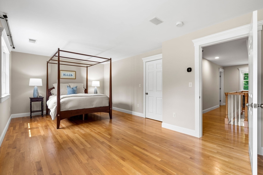 338 Pond Street Dunstable, MA 01827 - Photo 22 of 42 a bedroom with a bed and a mirror