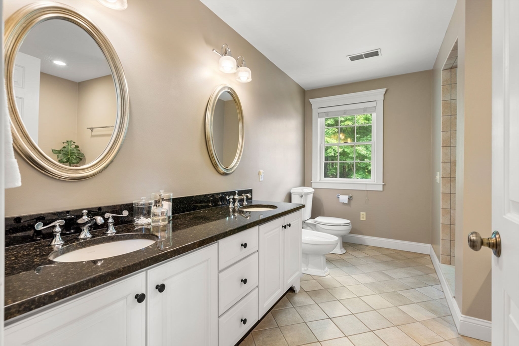 338 Pond Street Dunstable, MA 01827 - Photo 24 of 42 a bathroom with a double vanity sink and a mirror
