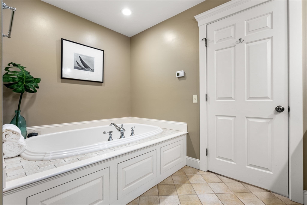338 Pond Street Dunstable, MA 01827 - Photo 26 of 42 a spacious bathroom with a tub and shower