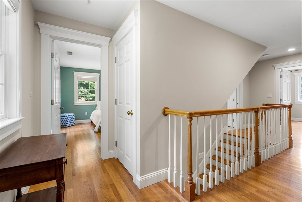 338 Pond Street Dunstable, MA 01827 - Photo 27 of 42 a view of a hallway with wooden floor and furniture