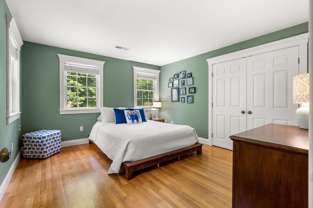 338 Pond Street Dunstable, MA 01827 - Photo 28 of 42 a bedroom with a bed and wooden floor