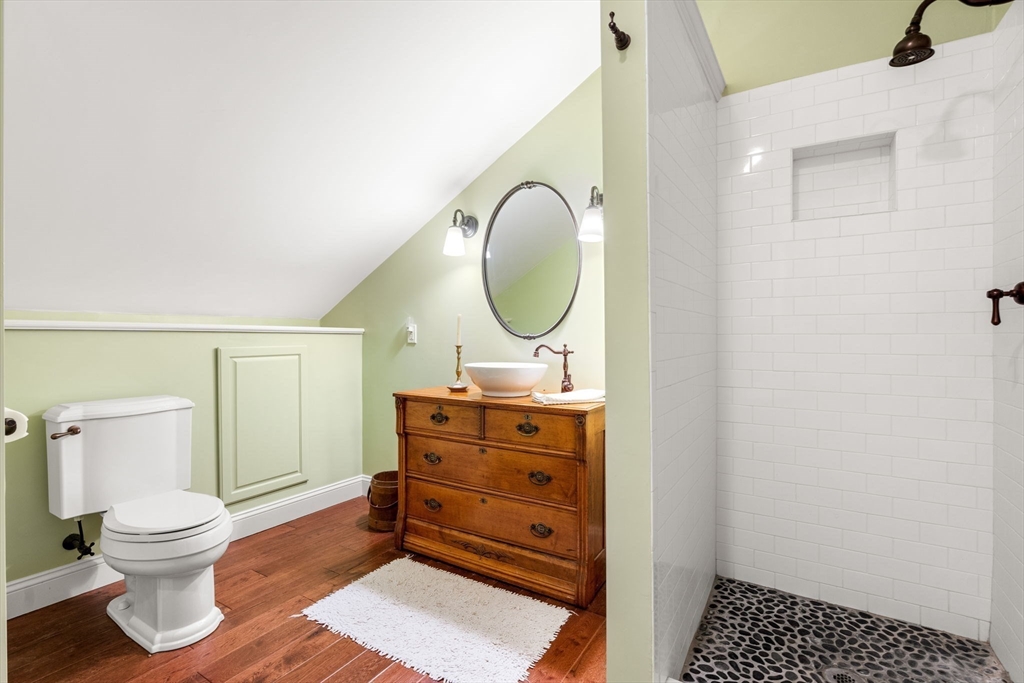 338 Pond Street Dunstable, MA 01827 - Photo 33 of 42 a bathroom with a toilet a sink and a mirror