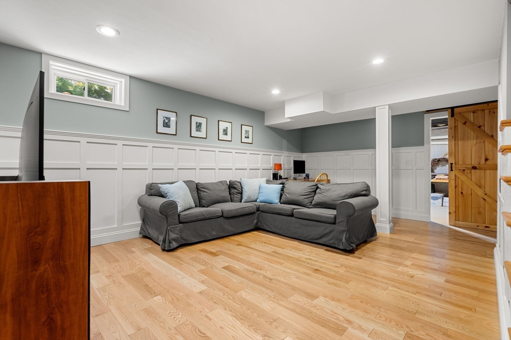 338 Pond Street Dunstable, MA 01827 - Photo 36 of 42 a living room with furniture and a wooden floor