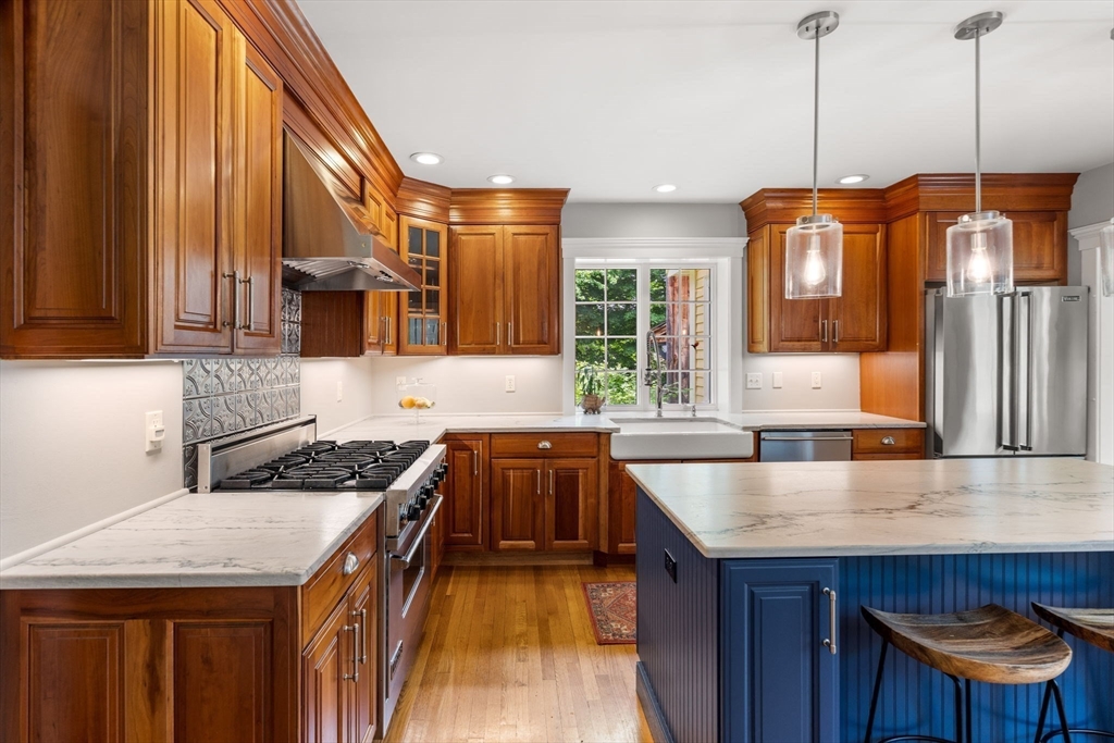 338 Pond Street Dunstable, MA 01827 - Photo 5 of 42 a kitchen with granite countertop a sink a counter space appliances and cabinets