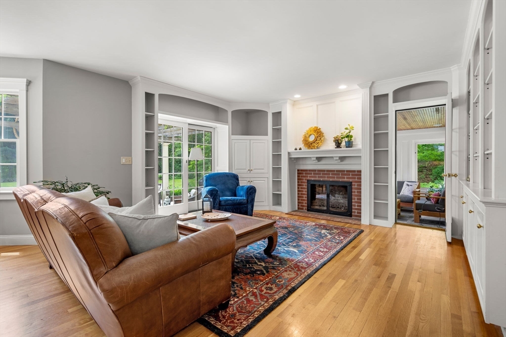 338 Pond Street Dunstable, MA 01827 - Photo 9 of 42 a living room with furniture and a fireplace