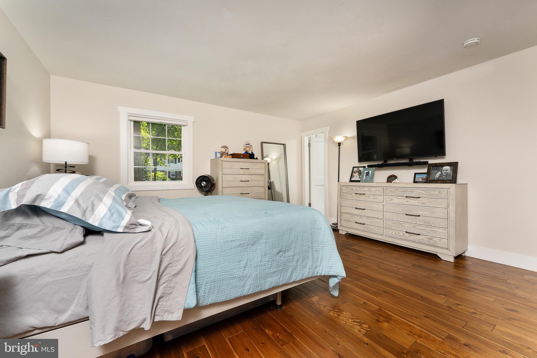 2425 Hunter Mill Road Vienna, VA 22181 - Photo 13 of 28 a bedroom with a bed and a television