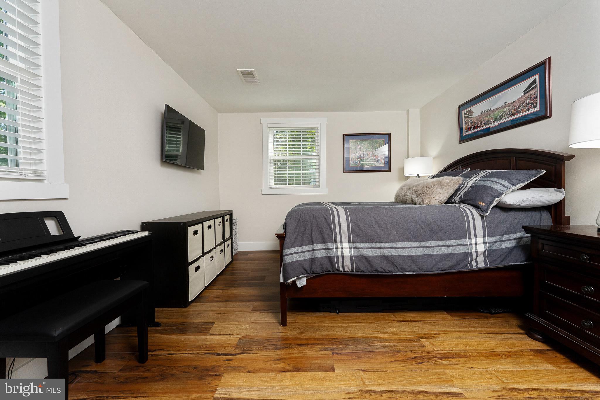 2425 Hunter Mill Road Vienna, VA 22181 - Photo 21 of 28 a living room with furniture and a flat screen tv