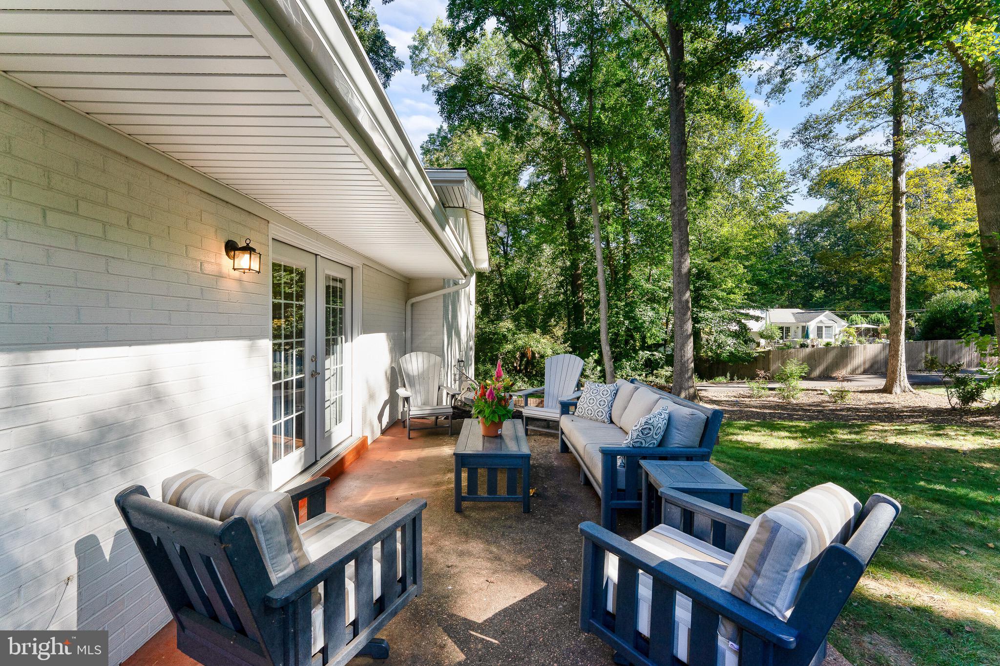 2425 Hunter Mill Road Vienna, VA 22181 - Photo 26 of 28 a backyard of a house with outdoor seating