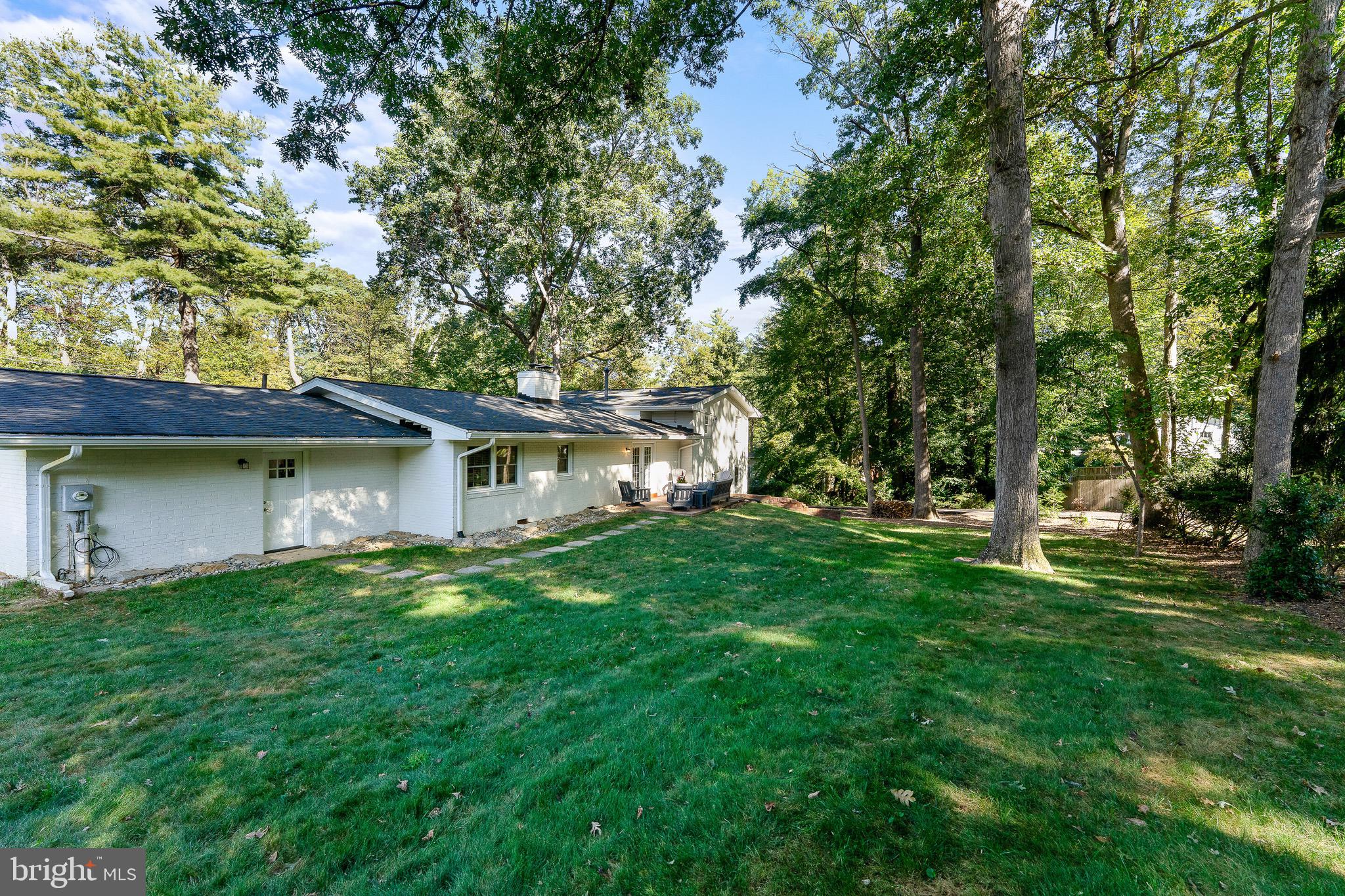 2425 Hunter Mill Road Vienna, VA 22181 - Photo 27 of 28 a front view of a house with a garden
