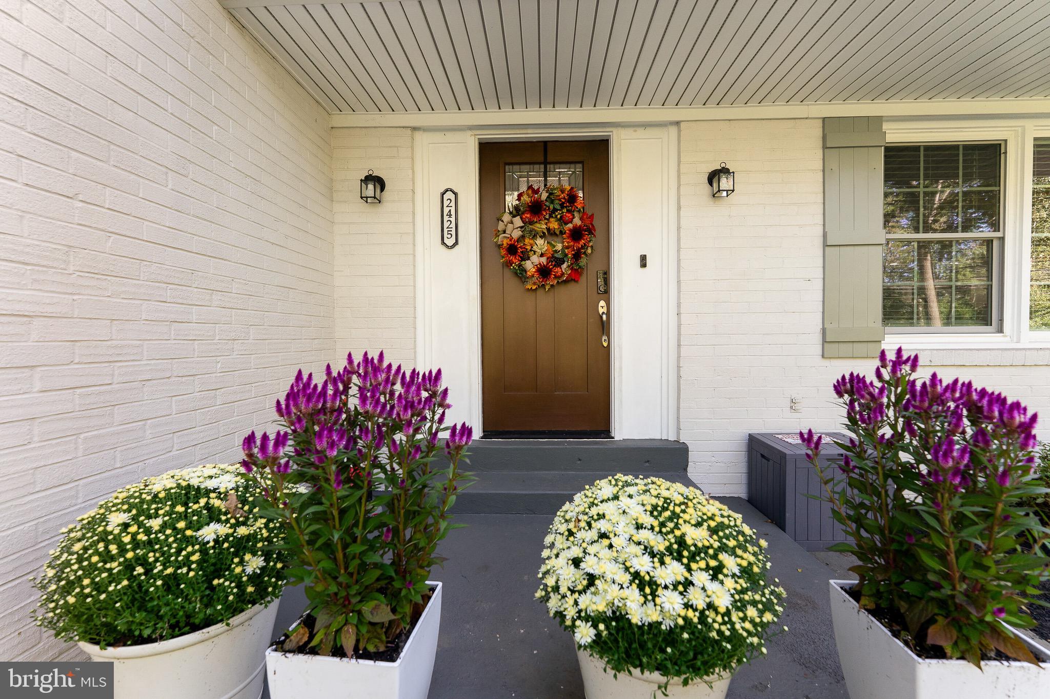 2425 Hunter Mill Road Vienna, VA 22181 - Photo 3 of 28 a flowers in front of a house