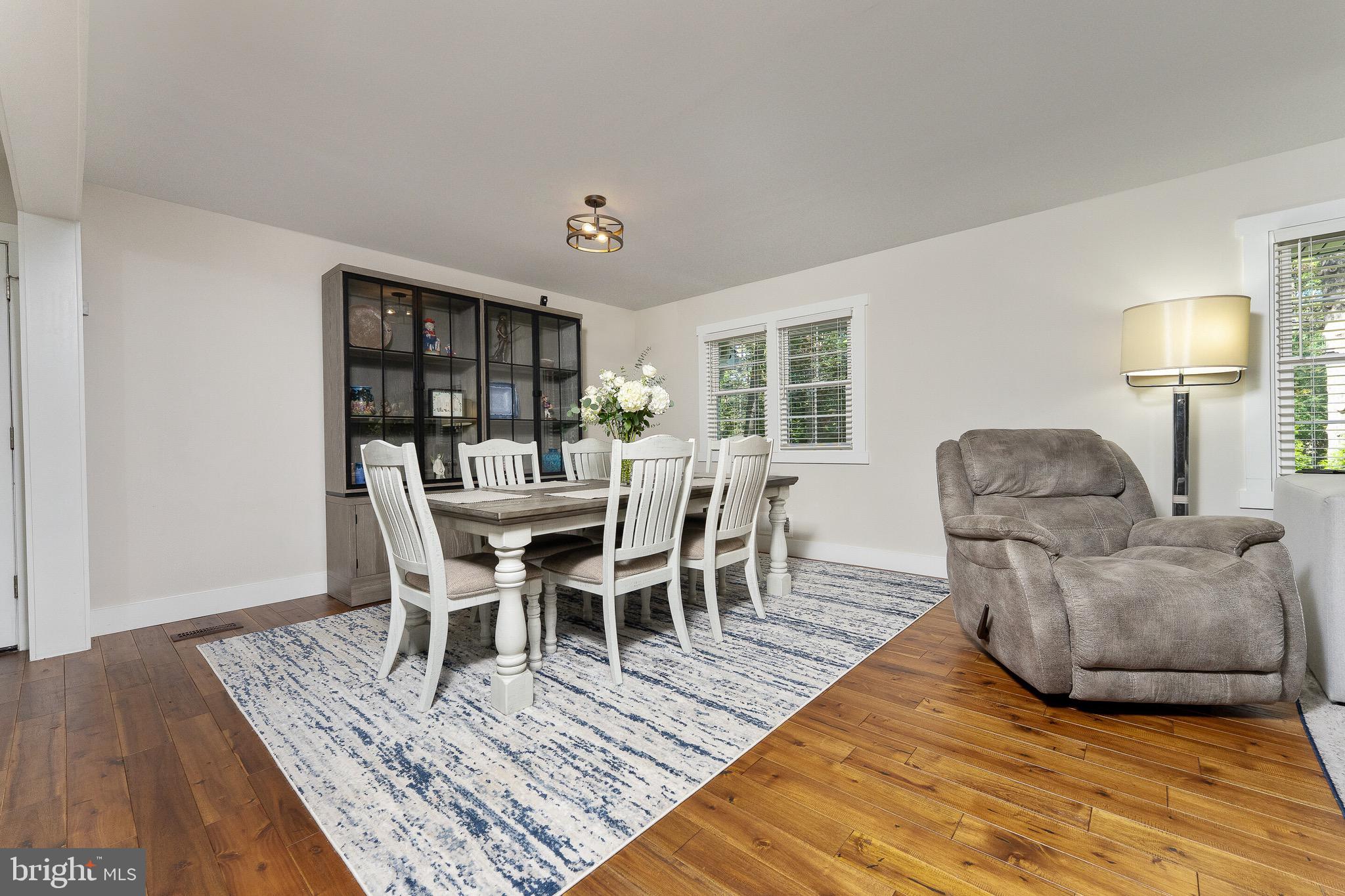 2425 Hunter Mill Road Vienna, VA 22181 - Photo 5 of 28 a living room with furniture and a wooden floor