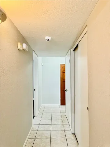 a view of hallway with natural light